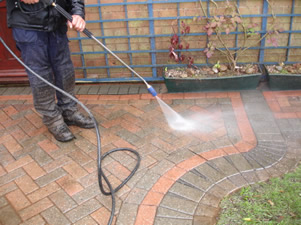 man doing block-pavement-cleaning